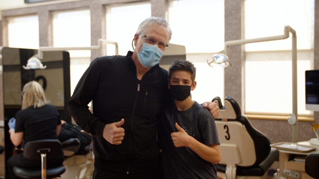 Dr. Roeder and patient giving thumbs up