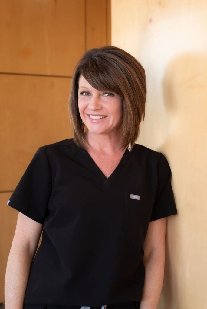 a woman in black scrubs